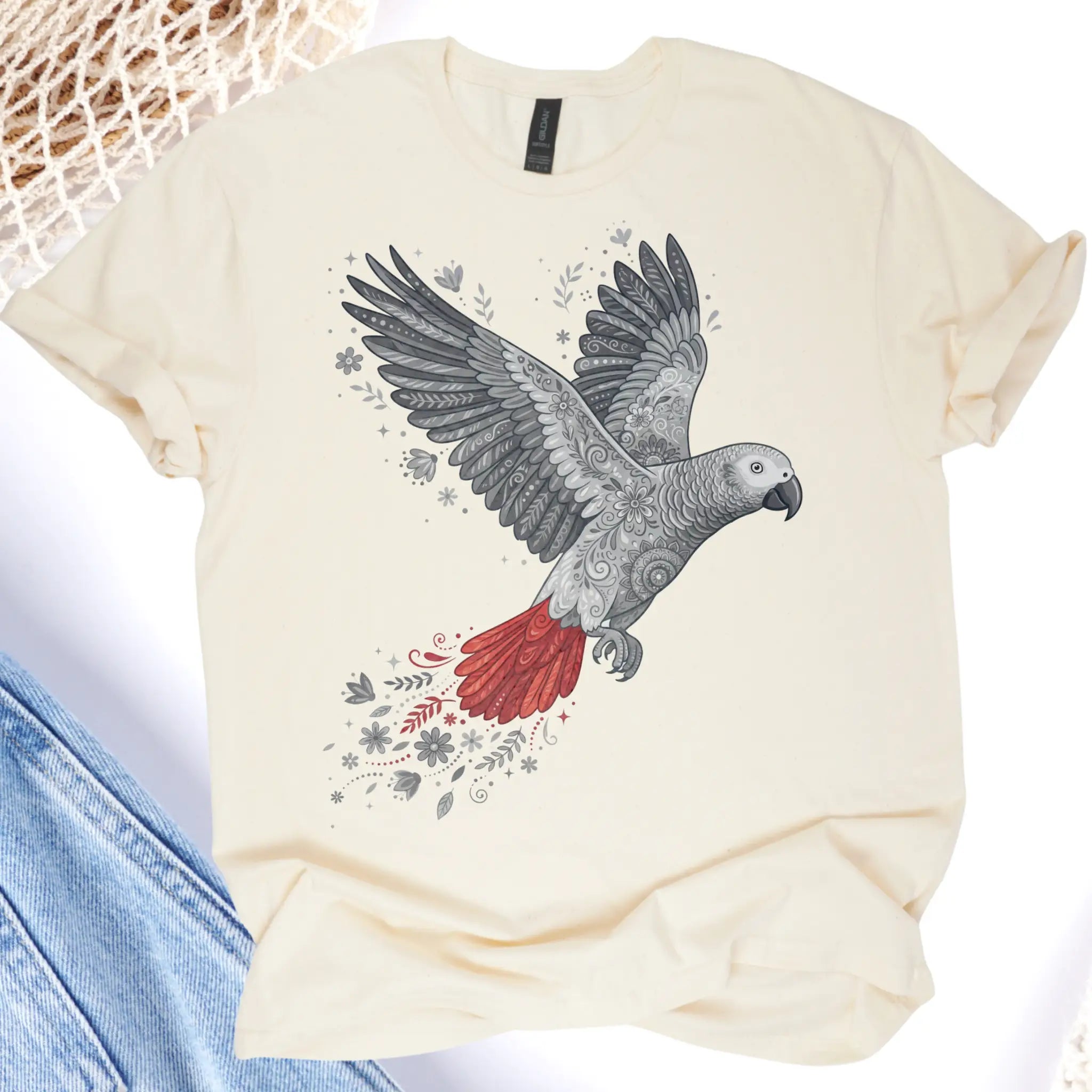 Beige t-shirt with a parrot design on a white background