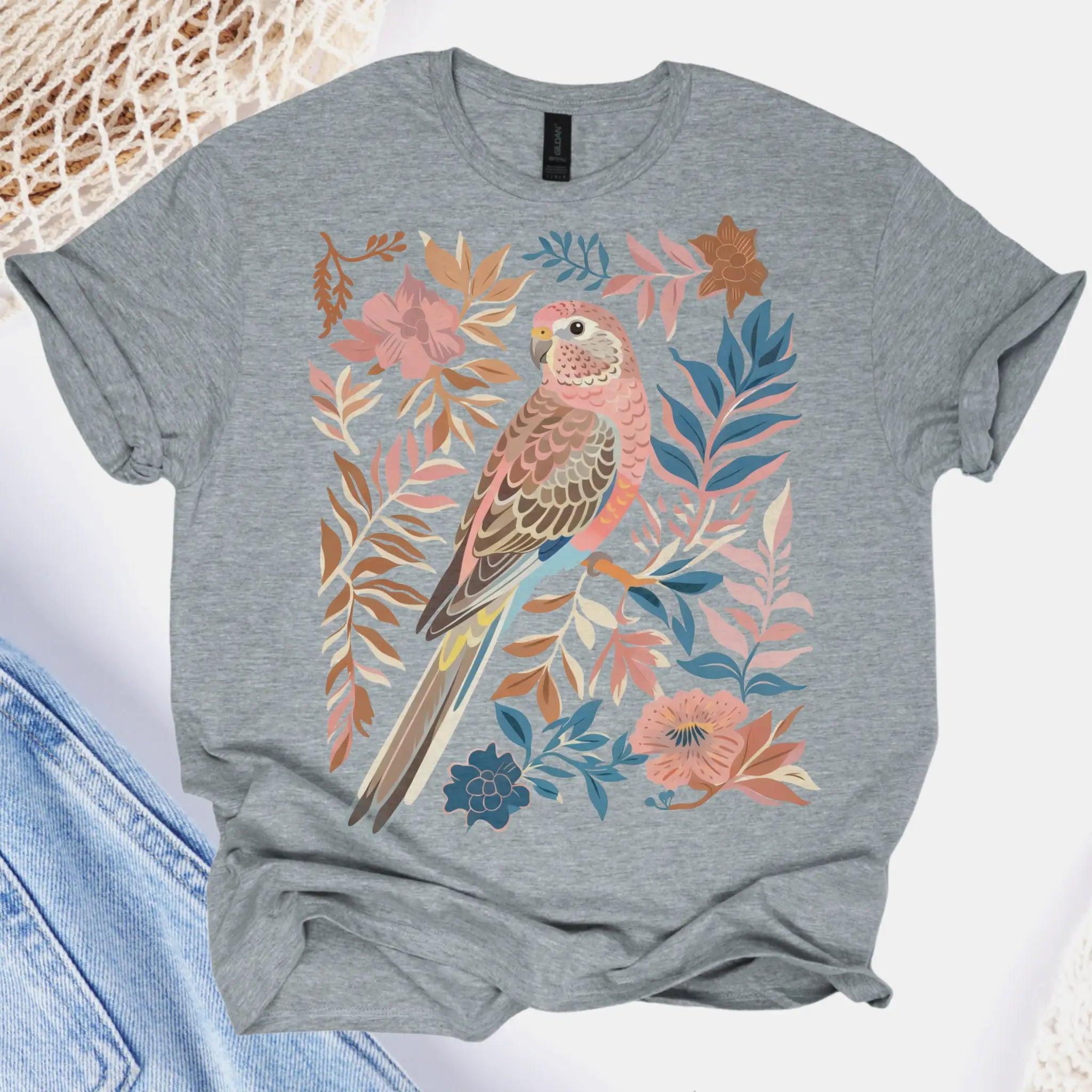 Gray t-shirt with a bird and floral design on a white background