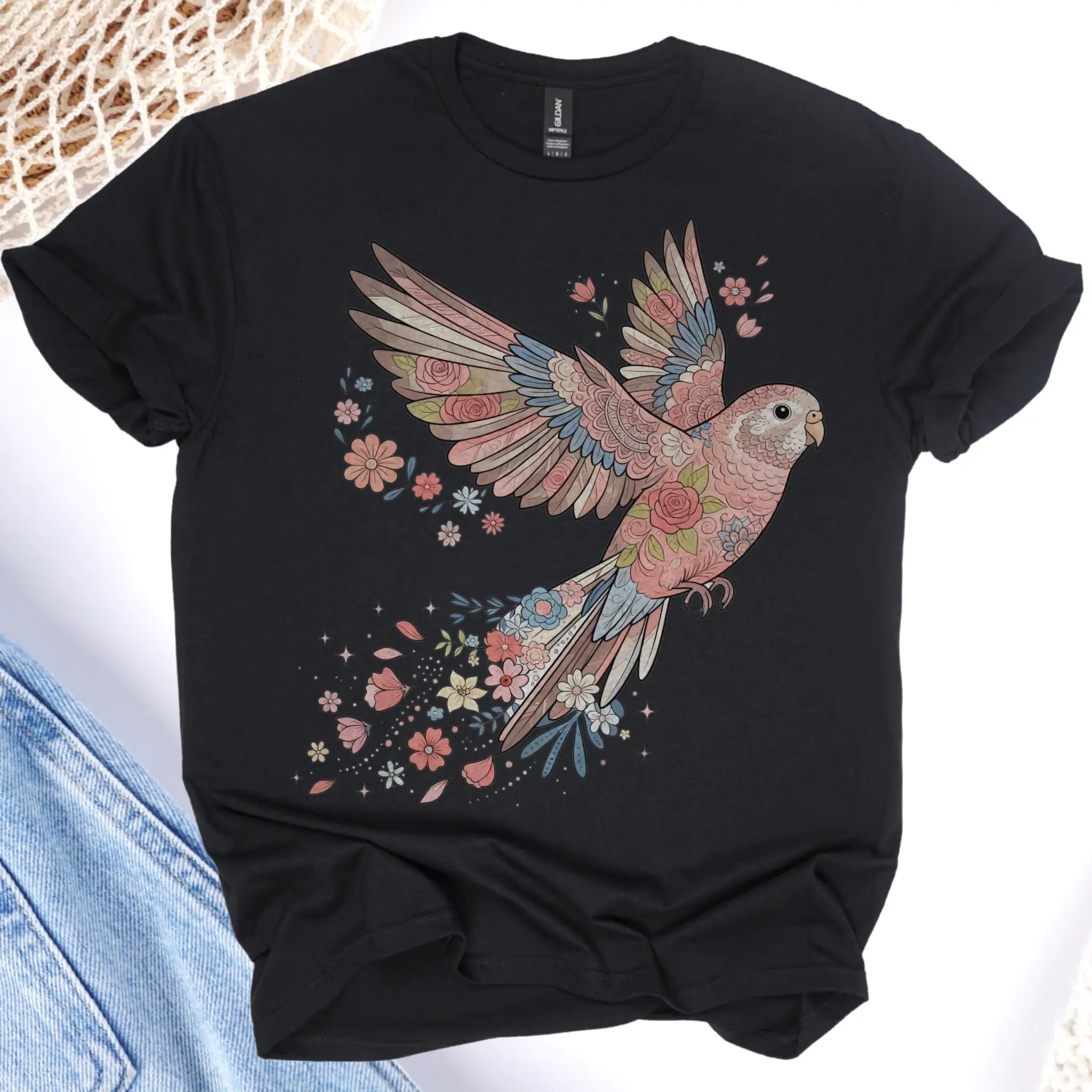 Black t-shirt with a colorful parrot design on a white background