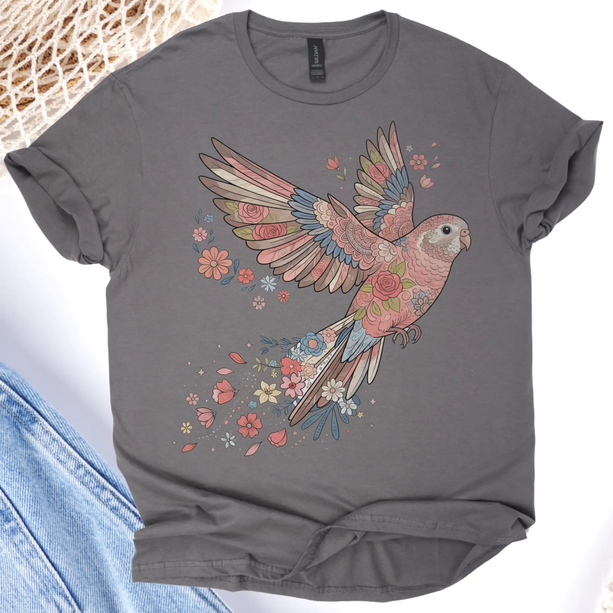 Gray t-shirt with a colorful parrot design on a white background