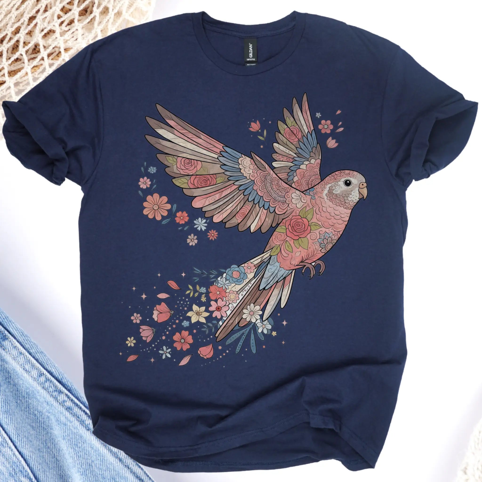Navy blue t-shirt with a colorful parrot and floral design on a white background