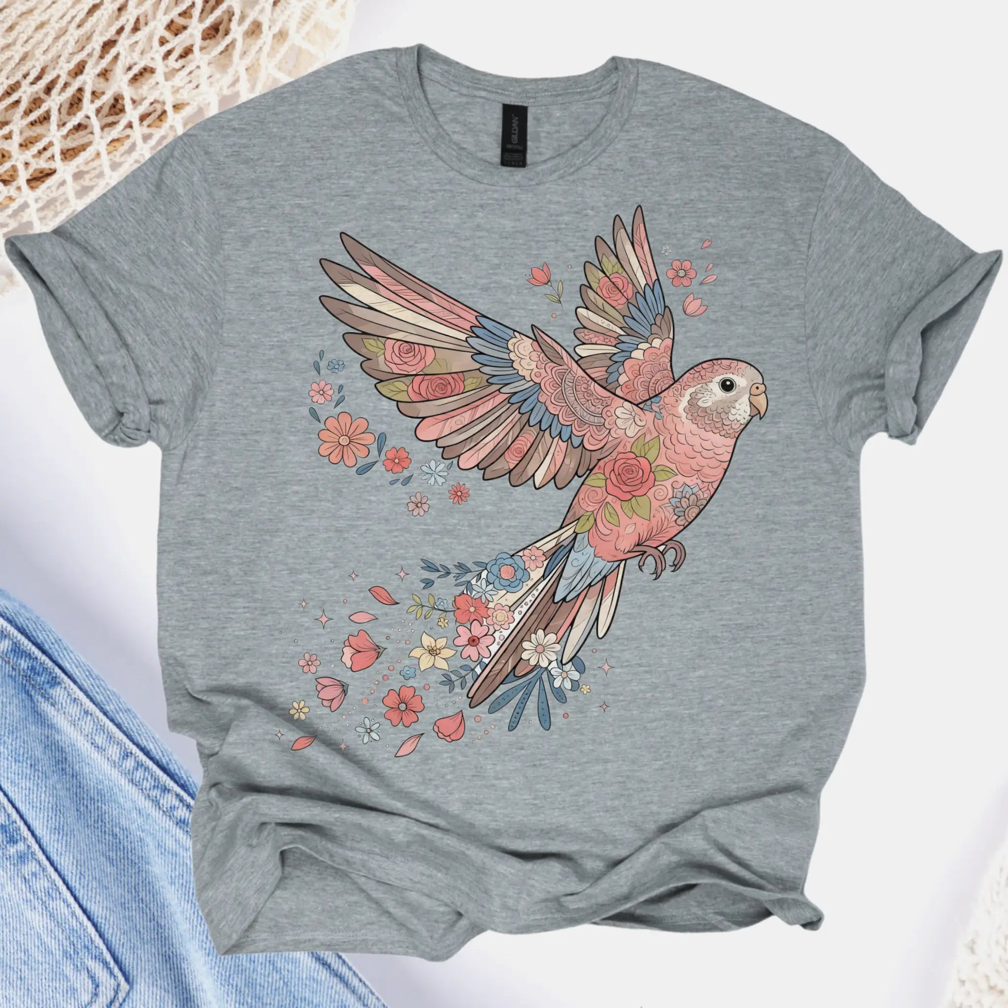 Gray t-shirt with a colorful parrot design on a white background