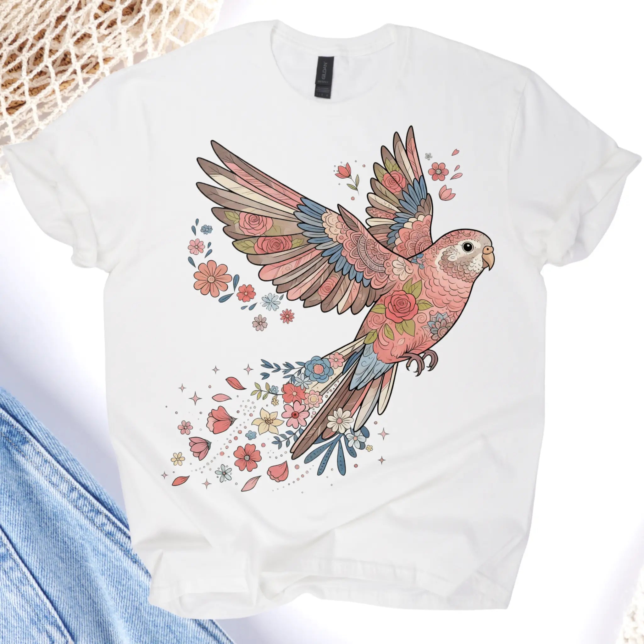 White t-shirt with a colorful parrot design on a white background